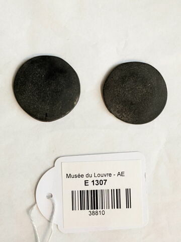 rondelle ; élément d'incrustation de statue