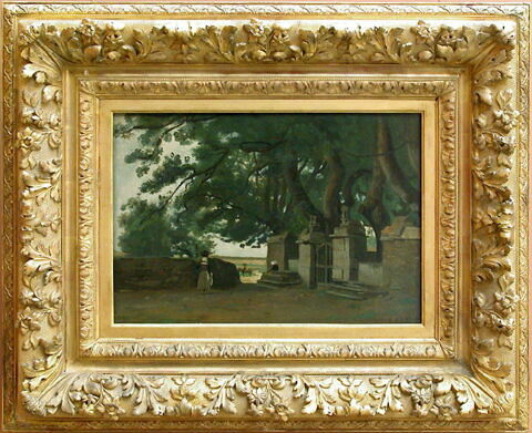Paysage breton : une grille ombragée par de grands arbres., image 2/3