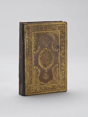Reliure à décor de mandorle, fleurettes et tchis