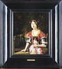 Portrait d'une jeune femme tenant un petit chien, sur fond agreste, image 4/4